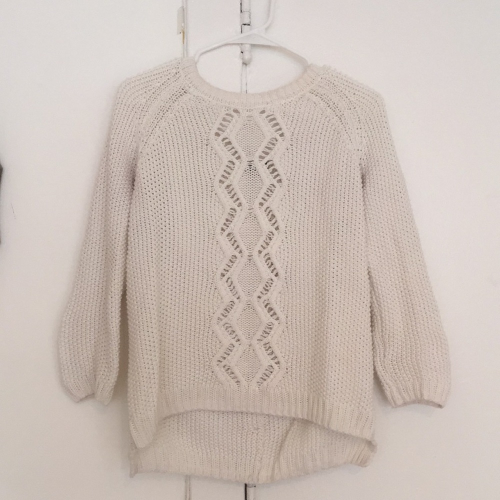 White sweater with button detail down the back